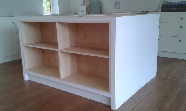 Cabinet installed with sides to form kitchen island.